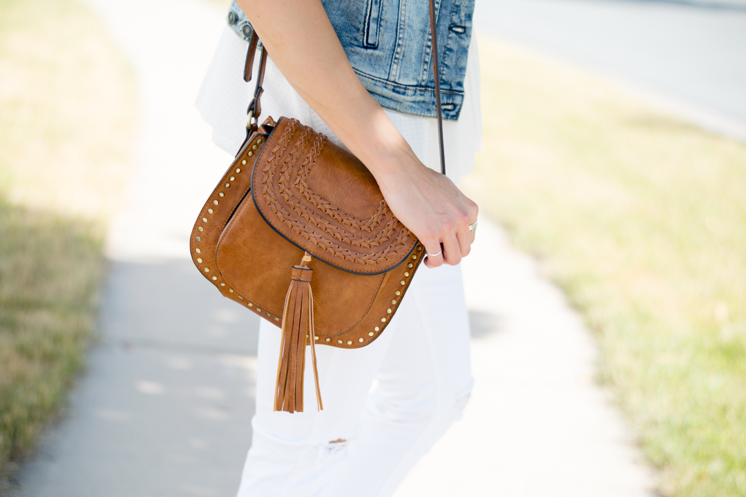 cognac-tassel-saddle-bag