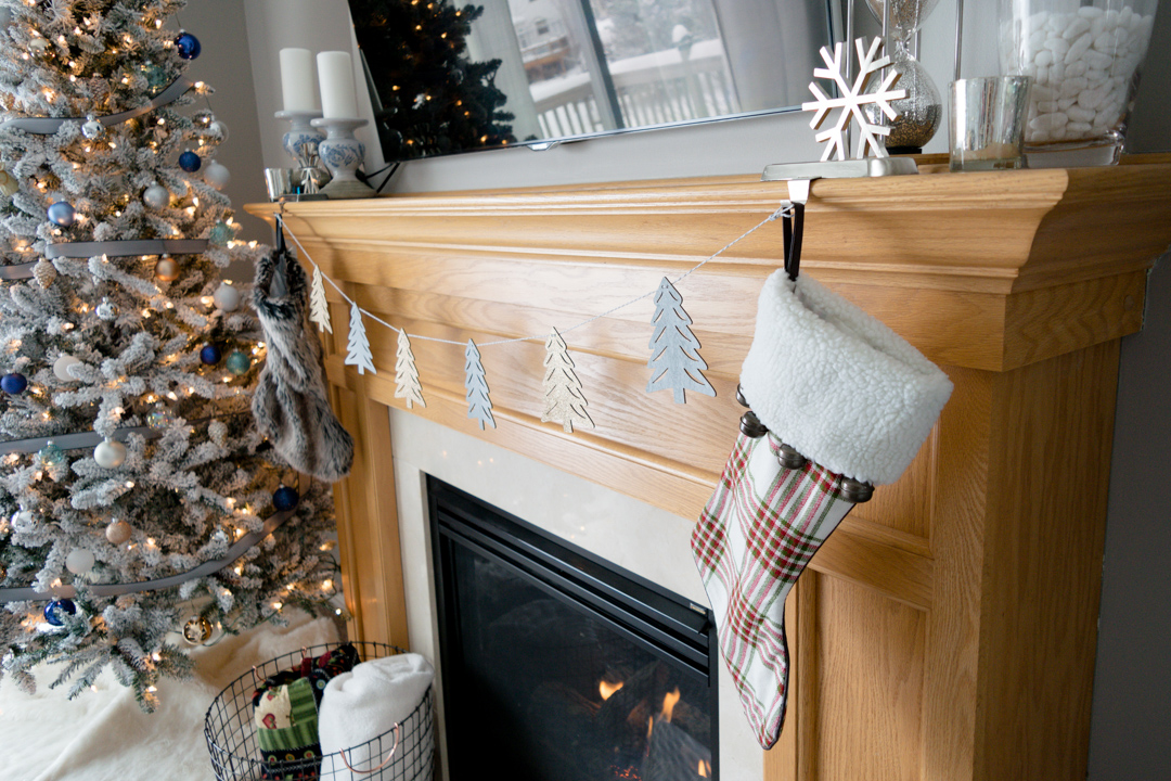 mantle christmas decor, stockings on mantle, garland on fireplace