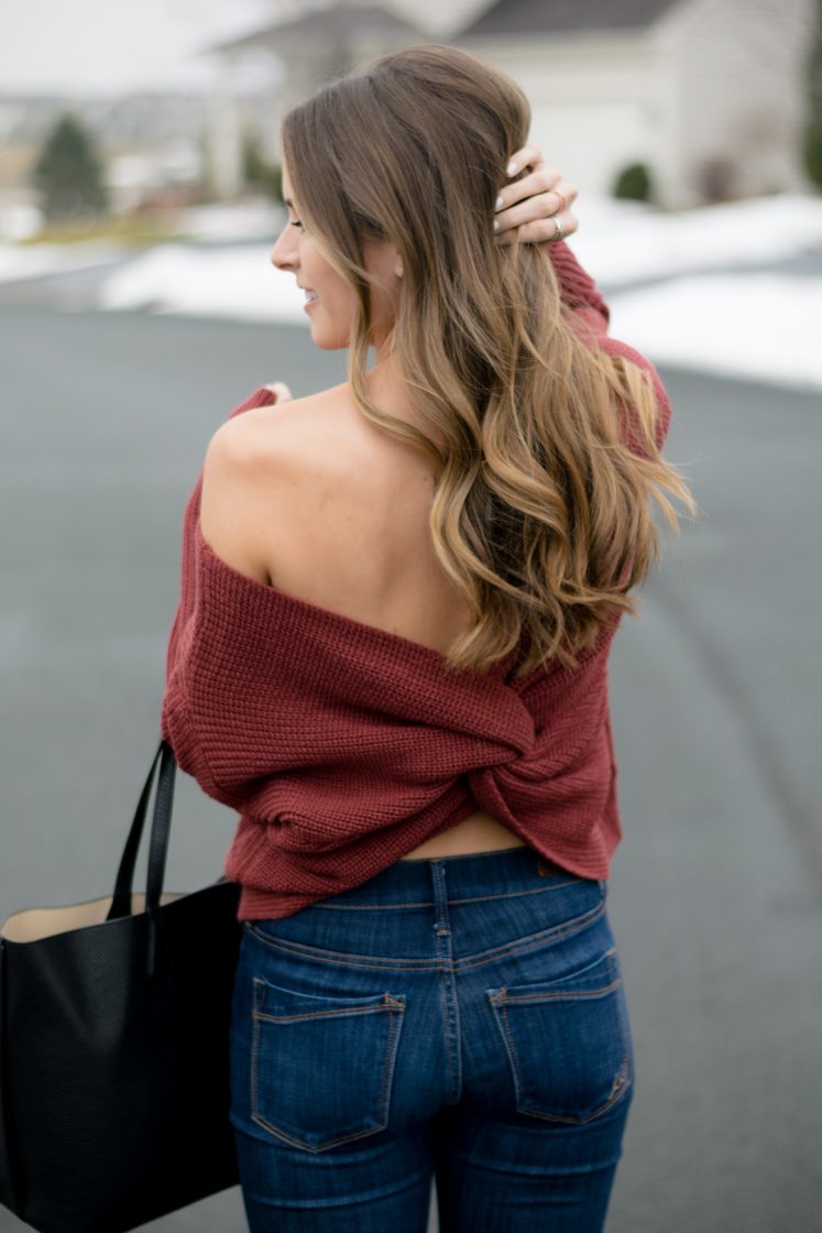 shein back twist sweater, express hi rise skinny jeans, tory burch perry tote black, open back sweater, off the shoulder sweater, bronde balayage hair color